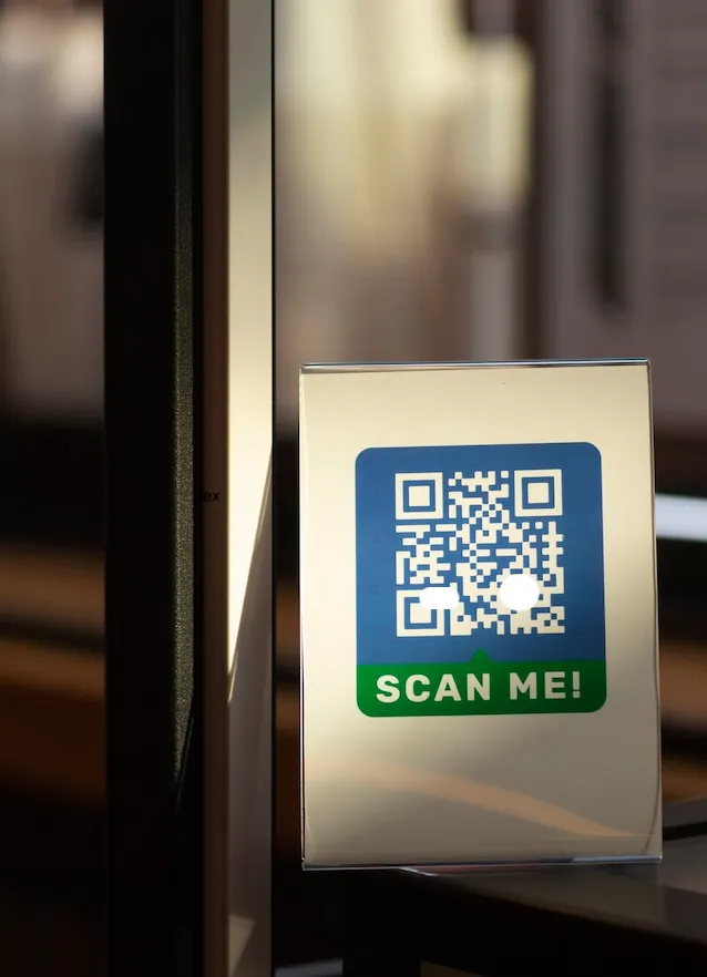 QR code access sign on a glass door